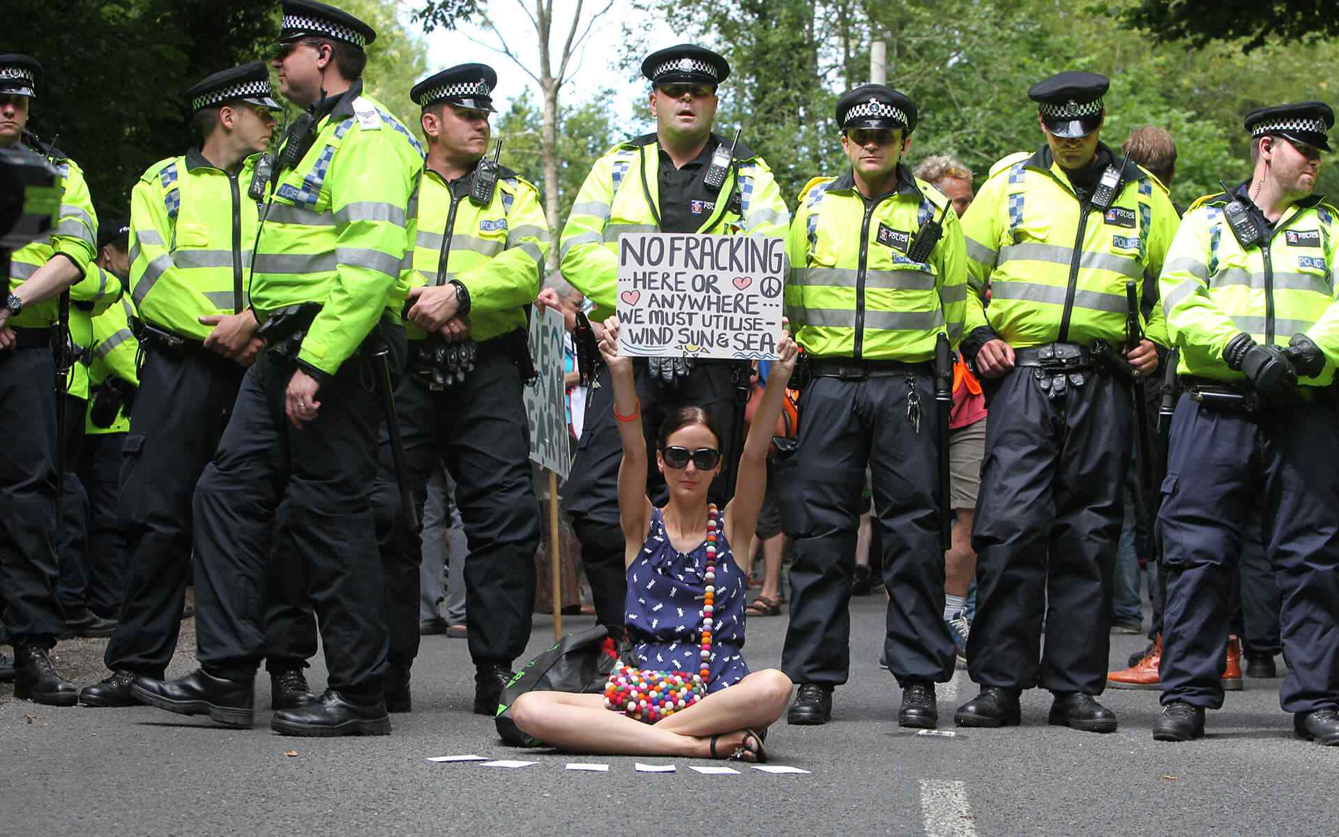 https://realclimatesolution.com/wp-content/uploads/2019/03/woman_protest.jpg